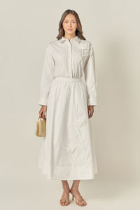 Appliqued accent midi skirt by voglio.us featuring a stylish design and detailed fabric pattern, shown on a model.