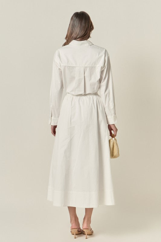 Appliqued accent midi skirt by voglio.us featuring a stylish design, shown in a close-up view highlighting the fabric and detailing.