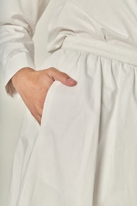 Appliqued accent midi skirt by voglio.us featuring a stylish design and flowing fabric, shown in a side view.