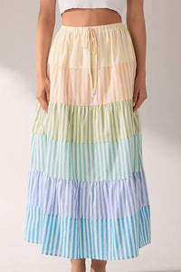 Striped color block tiered maxi skirt by voglio.us featuring vibrant horizontal stripes and flowing layered design.