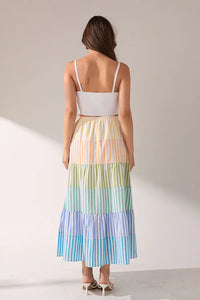Striped color block tiered maxi skirt from voglio.us featuring bold horizontal stripes and flowing fabric.