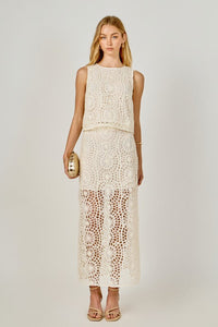 Textured midi skirt from voglio.us, showcasing a stylish, flowy design with a textured fabric in a natural setting.