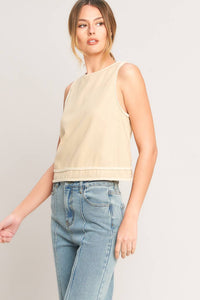 Chic minimal cropped top from voglio.us, featuring a sleek design and soft fabric, shown on a model against a neutral background.