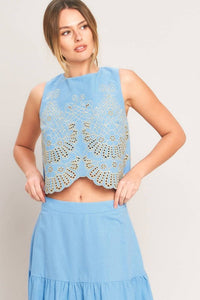 Voglio.us sleeveless blouse with embroidered scalloped hem, stylish top featuring intricate embroidery and a feminine design.
