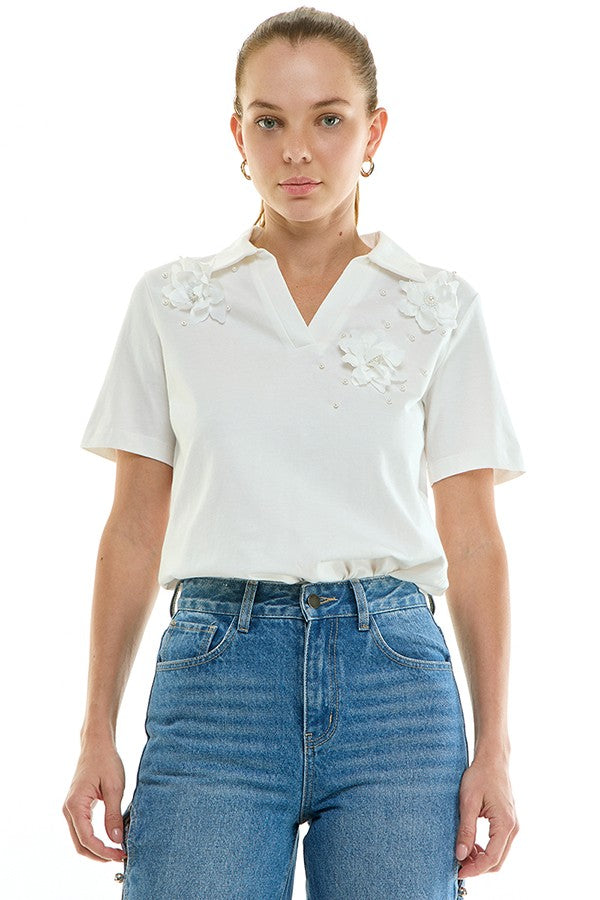 Voglio.us floral appliqué polo top featuring colorful embroidered flowers on a classic polo shirt for women.