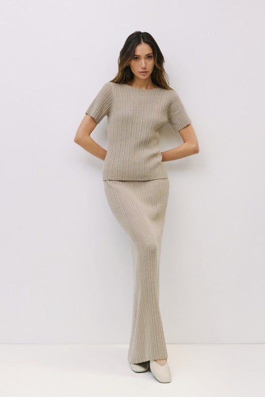 Neutral textured Joelle top by voglio.us, shown in a close-up image highlighting the fabric's pattern and stylish neckline.
