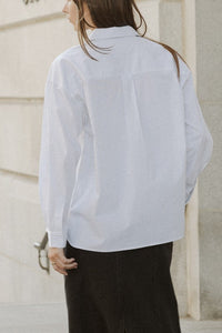 Oversized pinstripe button-down shirt top by voglio.us, featuring a classic collar and relaxed fit, shown on a hanger.