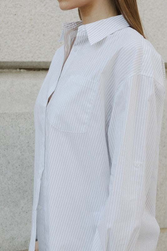 Oversized pinstripe button-down shirt from voglio.us, casual top with a relaxed fit and classic collar, shown on a hanger.