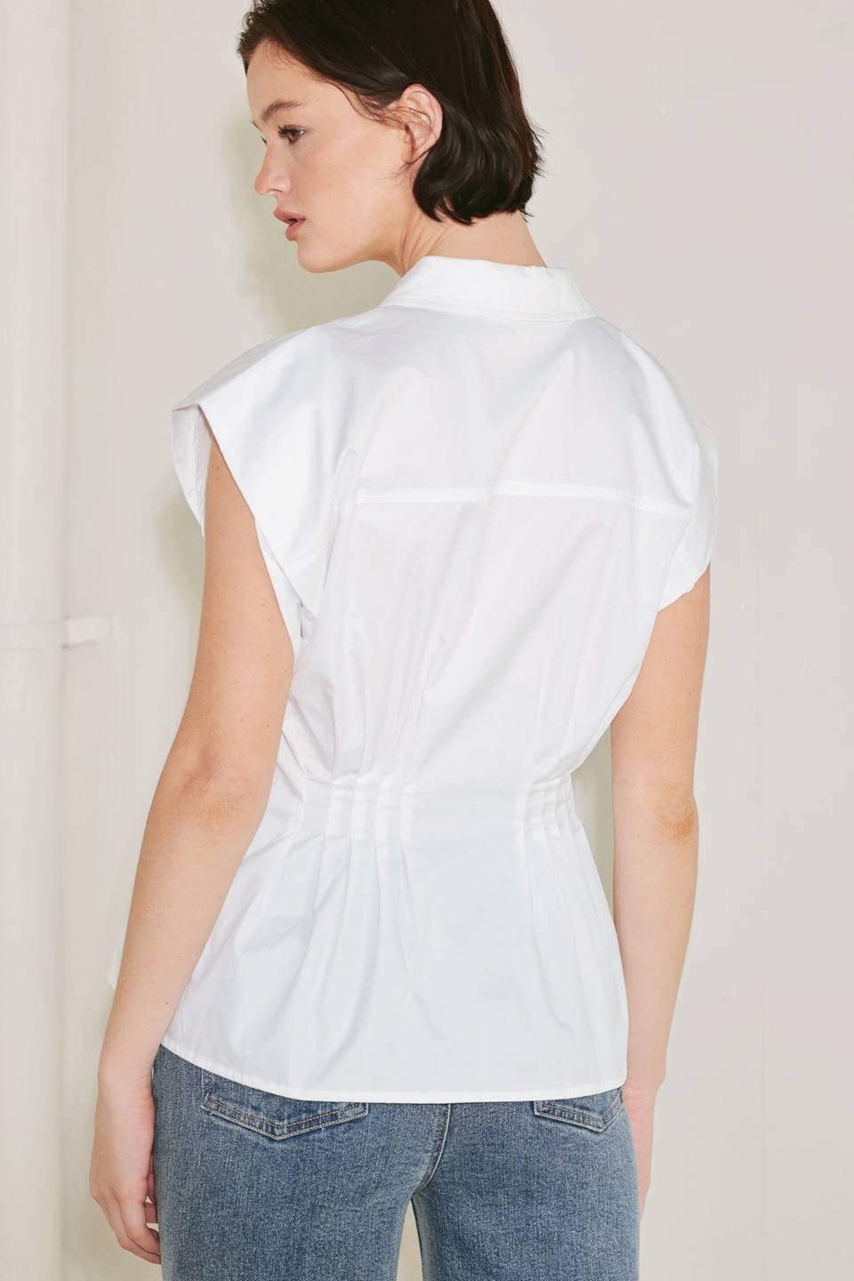 Voglio.us peplum top with corset waist, stylish sleeveless blouse featuring a fitted silhouette and flared hem, ideal for trendy outfits.