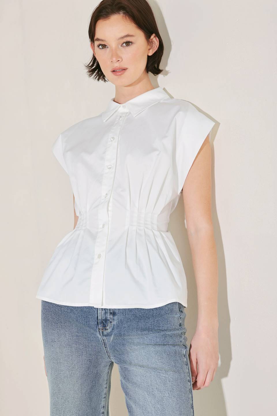 Voglio.us peplum top with corset waist, stylish sleeveless blouse featuring a fitted corset design and flared peplum hem.