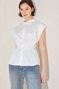 Voglio.us peplum top with corset waist, stylish sleeveless blouse featuring a fitted corset design and flared peplum hem.
