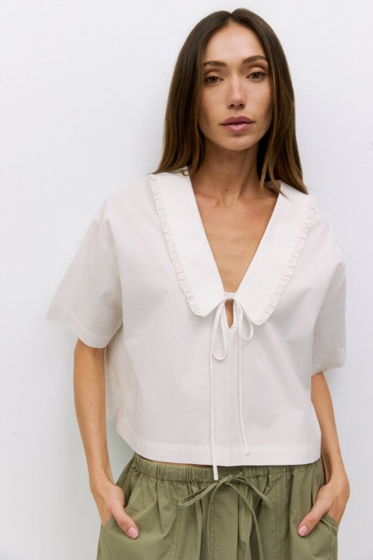 Voglio.us Roseanne V-Neck Tie Front Top, stylish women's top with v-neck and tie-front detail, shown in a flattering fit.