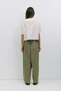 Voglio.us Roseanne V-neck tie-front top in soft fabric, featuring a stylish V-neck, long sleeves, and a front tie detail.
