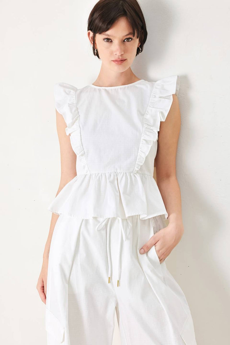 Voglio.us ruffle shoulder cotton peplum top featuring ruffled sleeves and a fitted waist, styled on a mannequin.