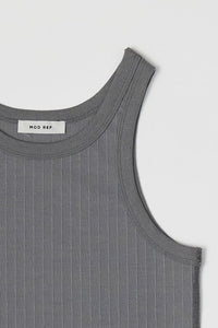 Ribbed fitted tank top from voglio.us in two color options, featuring a close-up of the textured fabric and sleeveless design.