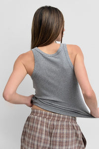 Ribbed fitted tank top in two color options, stylish and comfortable women's top by voglio.us, close-up of fabric and fit.