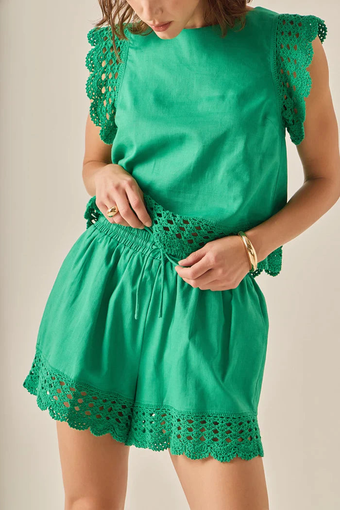 Voglio.us embroidered sleeveless top with intricate floral embroidery, lightweight fabric, and a stylish sleeveless design.