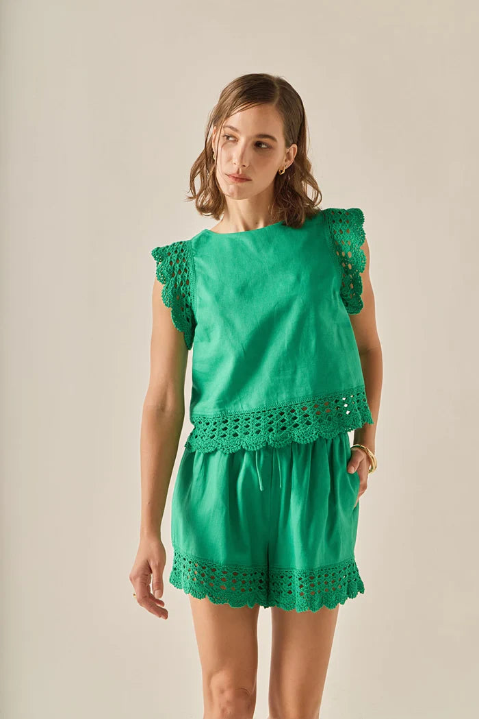 Embroidered sleeveless top from voglio.us featuring intricate embroidery and a lightweight, stylish design for warm weather.