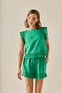 Embroidered sleeveless top from voglio.us featuring intricate embroidery and a lightweight, stylish design for warm weather.