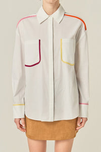 Flat binding detailed shirt top by voglio.us, featuring intricate design and tailored fit, shown on a mannequin.