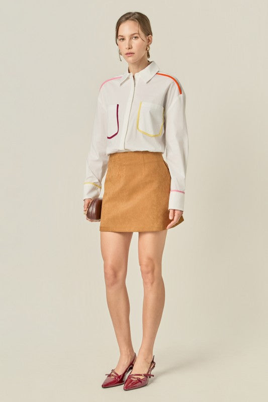 Flat binding detailed shirt top by voglio.us, featuring intricate design and tailored fit, displayed on a mannequin.