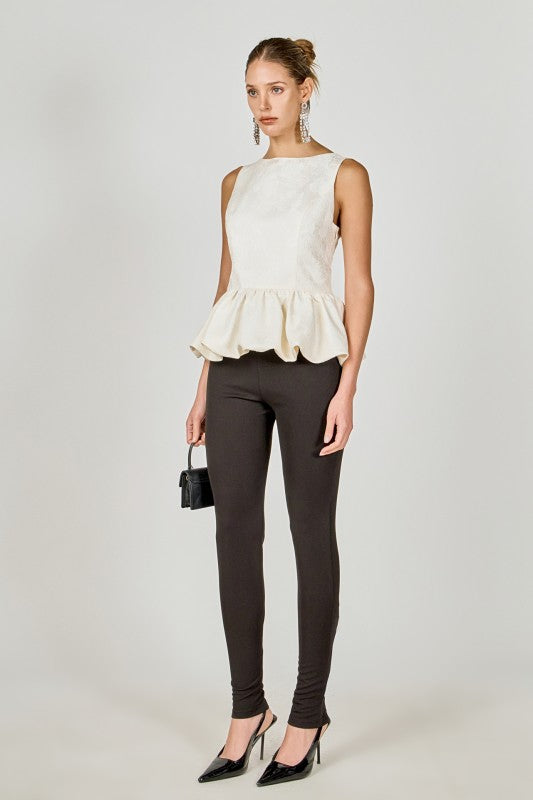 Voglio.us jacquard sleeveless peplum top in intricate fabric with a fitted bodice and flared peplum hem, shown on a model.