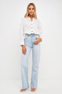 Light blue oversized collared shirt from voglio.us, featuring a relaxed fit and classic collar, perfect for casual wear.