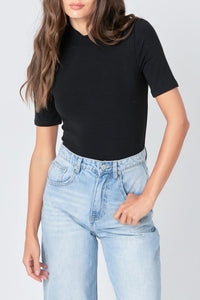 Soft black mock neck bodysuit by voglio.us, close-up of the fitted top with long sleeves and seamless design.