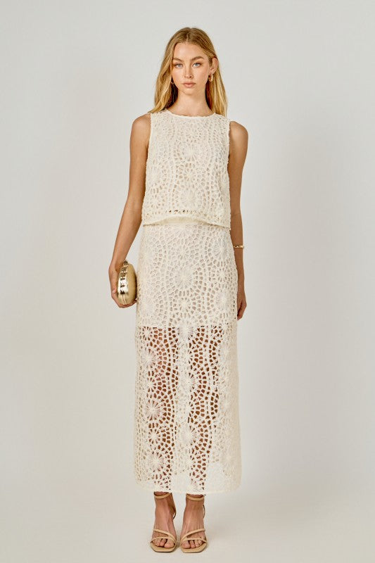 Textured sleeveless cropped top by voglio.us featuring a stylish design and comfortable fit, shown on a model.