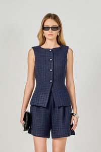 Tweed sleeveless vest with button details, stylish top from voglio.us featuring a textured fabric and tailored fit.
