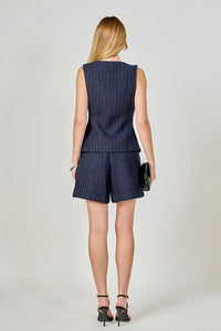 Tweed buttoned sleeveless vest top by voglio.us, featuring classic plaid pattern and tailored fit, displayed on a neutral background.