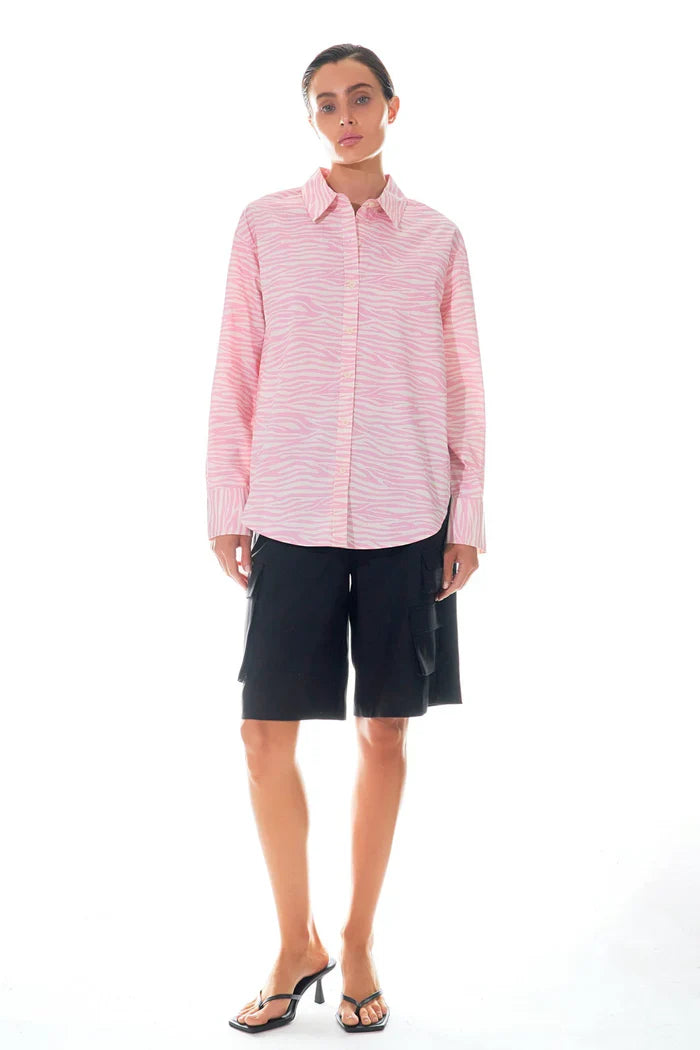 Zebra printed cotton top by voglio.us featuring a stylish pattern and casual fit, displayed on a hanger.