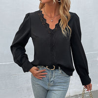 Long sleeved black lace women’s shirt from Wanita Store, stylish autumn top with elegant design and fitted silhouette.