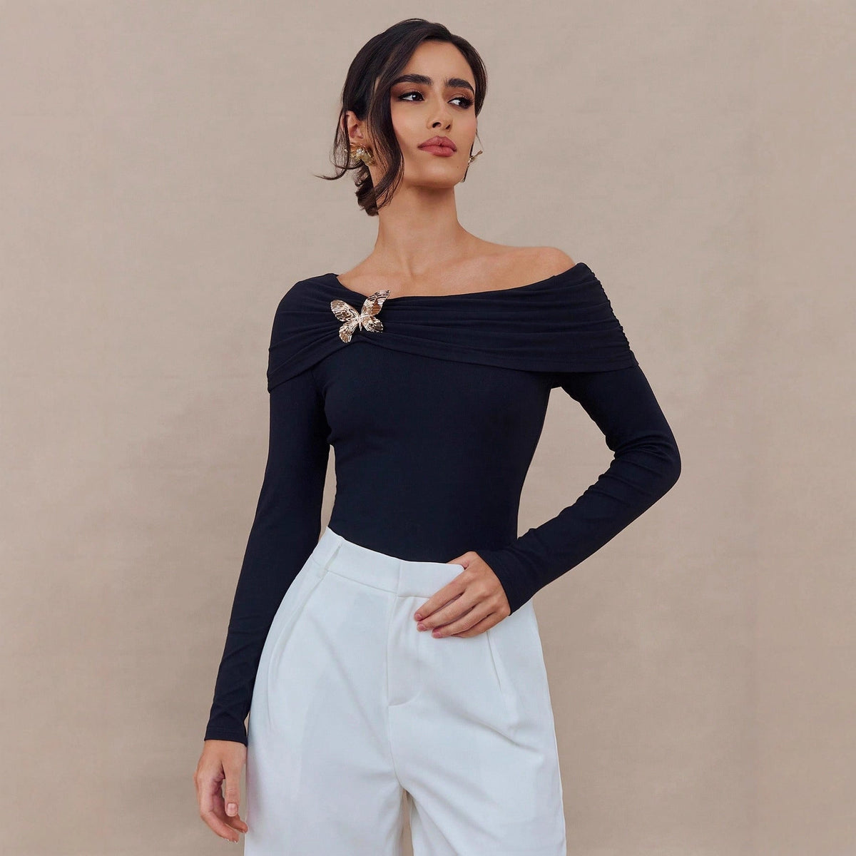 Black spring off-shoulder long sleeve women's top with butterfly brooch design, slim fit by Wanita Store.
