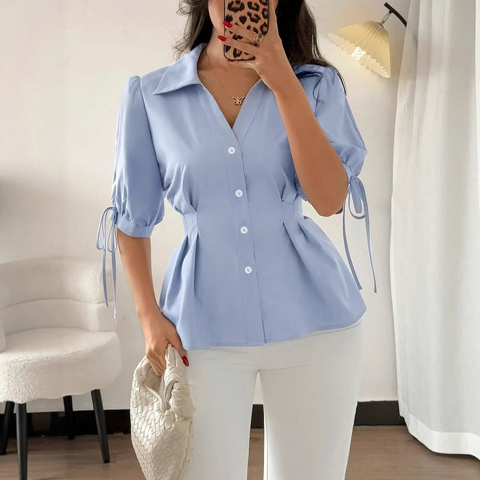Women’s slim office shirt with short sleeves, cuff detail, lace-up design, and pleated style in blue for spring and summer.
