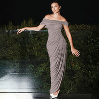 Khaki spring dress by Wanita Store featuring pleated off-shoulder neckline, backless design, and asymmetric solid color style.