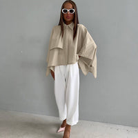 Women’s khaki spring casual loose-fit batwing sleeve cardigan shirt from Wanita Store, stylish and comfortable for everyday wear.