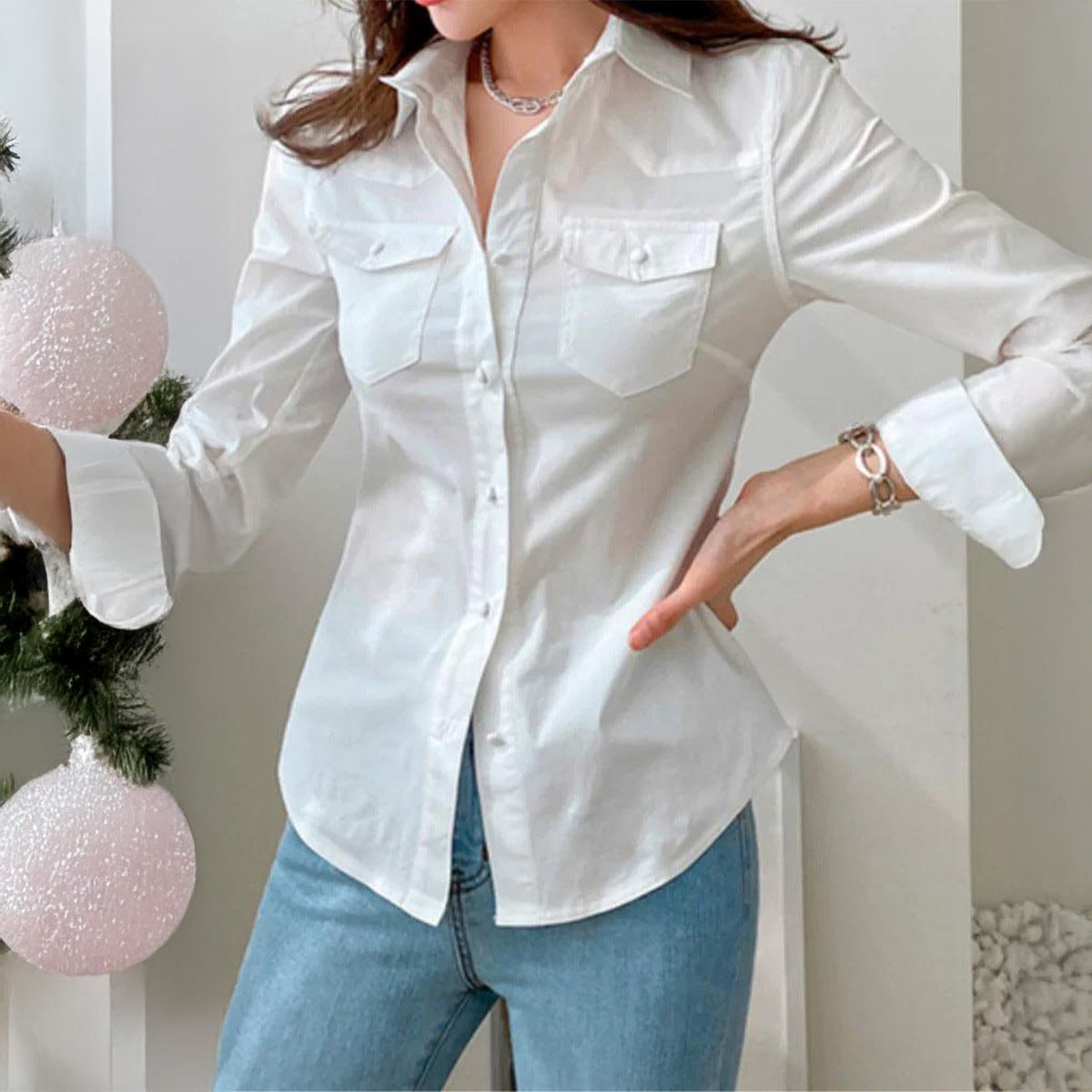 White women's long sleeve button-up top from Wanita Store, perfect for autumn and vacation styles.