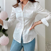 White women's long sleeve button-up top from Wanita Store, perfect for autumn and vacation styles.