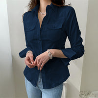 White women’s long sleeve button-up shirt from Wanita Store, perfect for autumn and vacation casual wear.