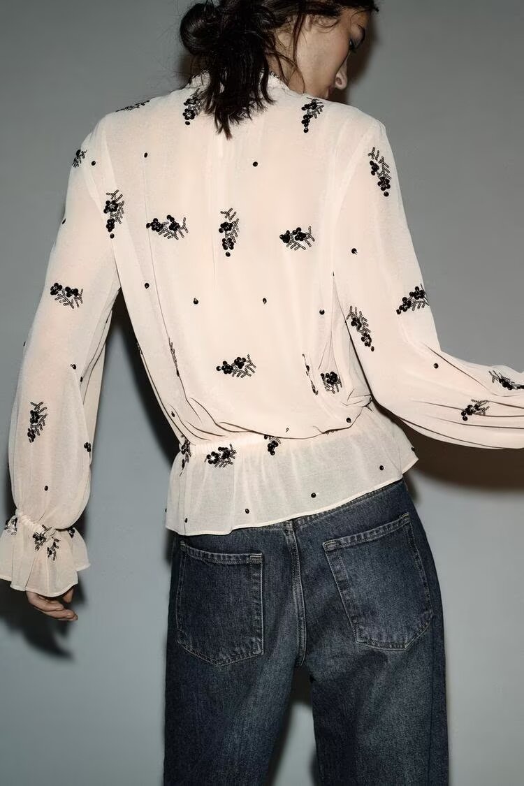 Winter fashionable sequin translucent shirt by Wanita Store, featuring a versatile, stylish design with shimmering sequins.