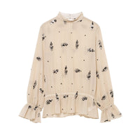 Winter fashionable sequin translucent shirt by Wanita Store featuring a shiny, all-match design for stylish winter wear.