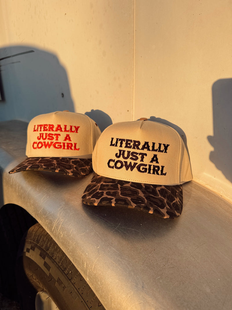 Black "Just a Cowgirl" baseball cap by Western Vogue Boutique, casual Western-style adornment with adjustable strap.