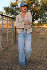 Light wash Cambree jeans by Western Vogue Boutique, showcasing classic denim bottoms with a relaxed fit and stylish design.