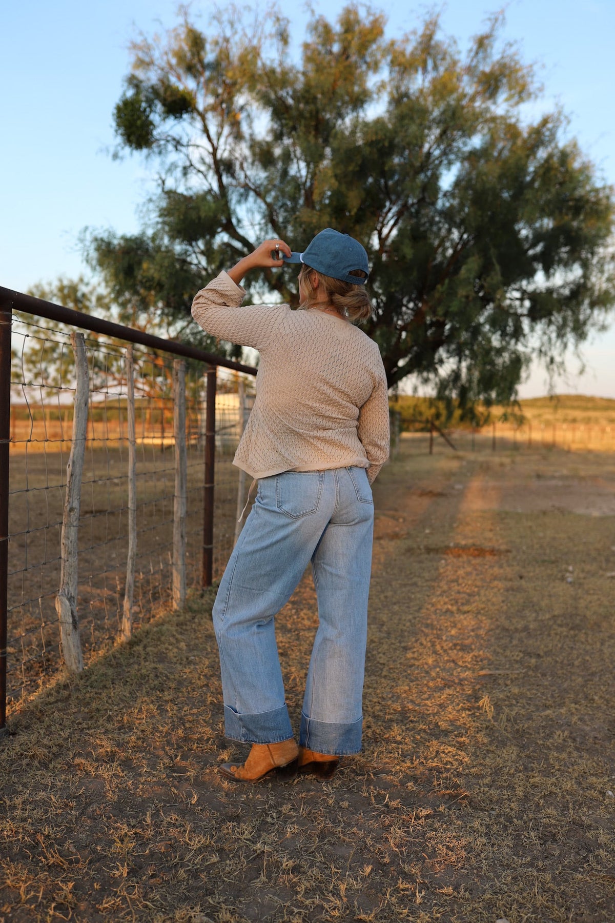 Light wash Cambree jeans by Western Vogue Boutique, showing classic denim bottoms with a relaxed fit and stylish design.