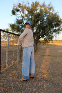 Light wash Cambree jeans by Western Vogue Boutique, stylish bottoms with classic denim details visible in the image.