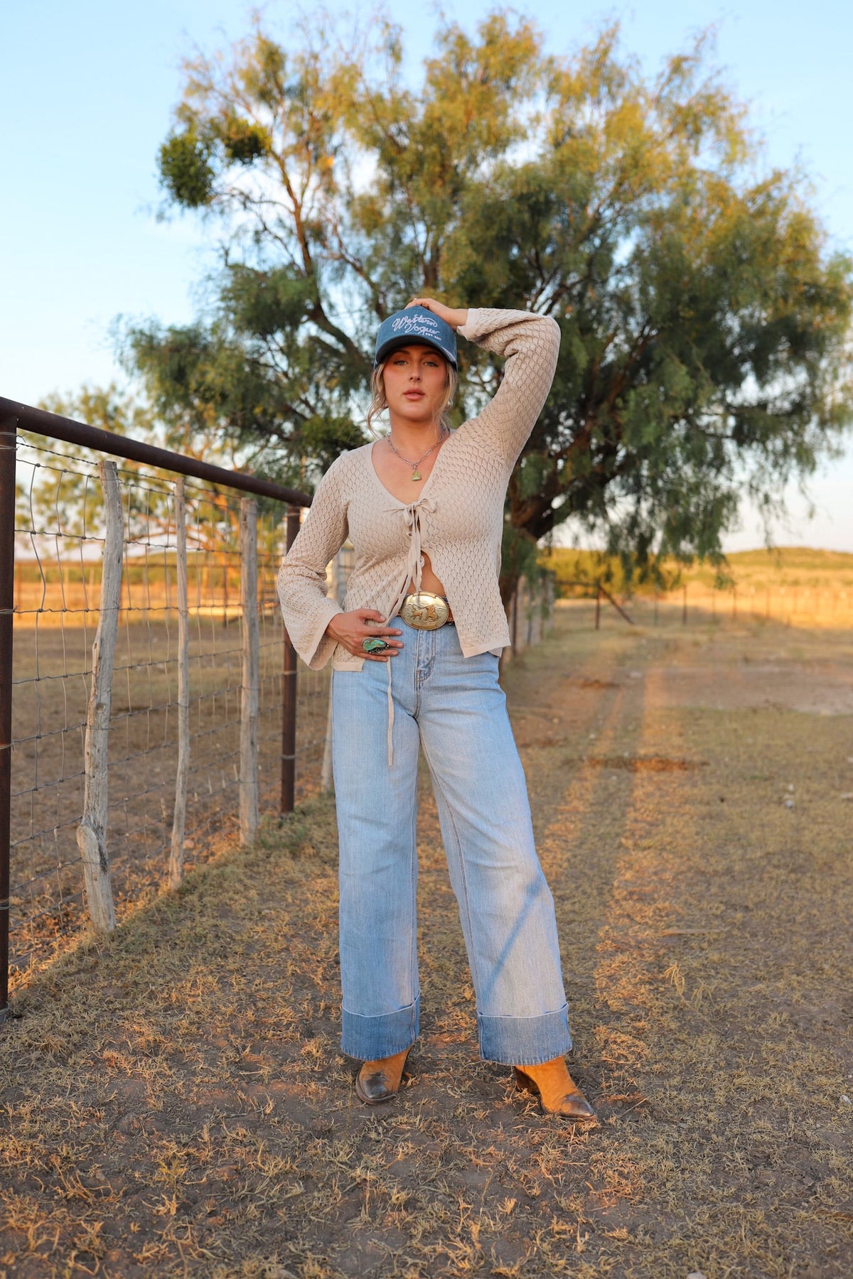 Light wash Cambree jeans by Western Vogue Boutique, stylish denim bottoms with classic five-pocket design and relaxed fit.