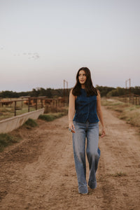 Medium wash Cambree women’s jeans by Western Vogue Boutique, stylish denim bottoms with classic fit and subtle fading.