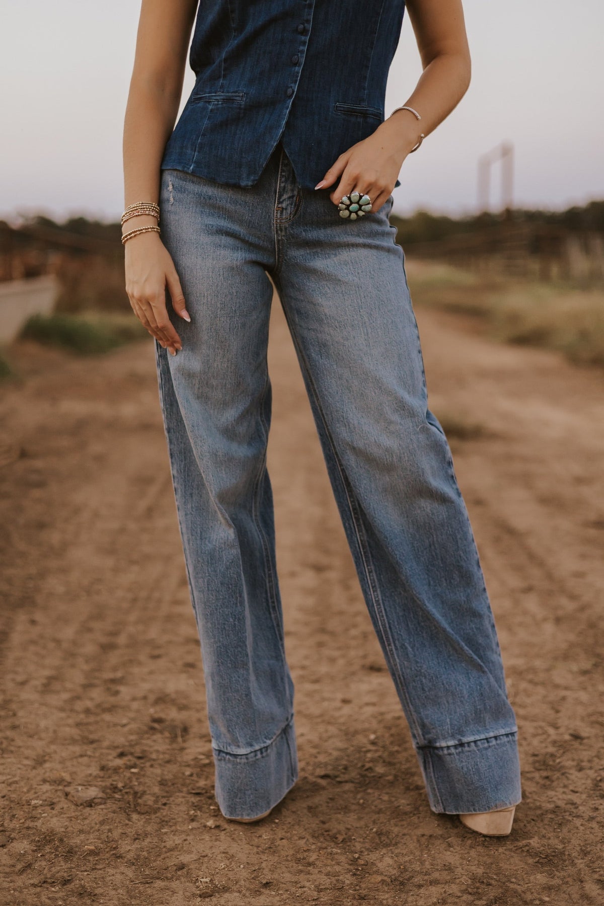 Medium wash The Cambree women’s jeans by Western Vogue Boutique, showcasing classic denim bottoms with a relaxed fit.