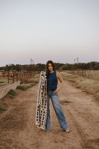 Medium wash women’s jeans from The Cambree collection by Western Vogue Boutique, featuring classic denim bottoms.